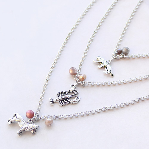 Elastic bracelets and layered necklaces with metal charms