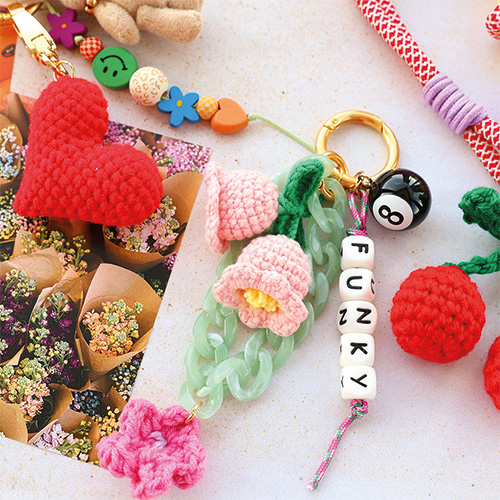 Create trendy keychains with crocheted and resin pendants
