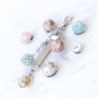Bracelets and keychains with pendants and cabochons of real flowers and shells