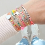 Bracelets of coloured cord with cute summery charms of stainless steel