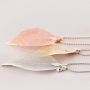 Delicate necklaces decorated with autumn leaf pendants 