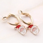Cheerful Christmas jewellery with gold and silver Christmas charms