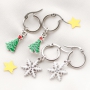 Cheerful Christmas jewellery with gold and silver Christmas charms