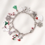 Cheerful Christmas jewellery with gold and silver Christmas charms