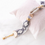 Handmade statement earrings + bracelets with snake print 