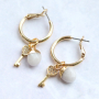 Trendy earrings and bracelets with zirconia charms and connectors: