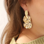 Earring inspiration with golden and silver charms and connectors