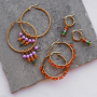 Design an earring collection with stainless steel creoles