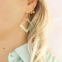 Create statement earrings with resin pendants