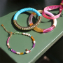 Inspiration for bracelets with acrylic beads, faceted beads and ribbon with text