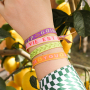 Inspiration for bracelets with acrylic beads, faceted beads and ribbon with text