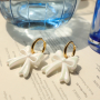 Jewellery inspiration with acrylic bow charms and heart earrings