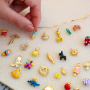 How to make cheerful jewellery with metal charms with enamel