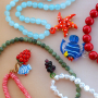 Make colourful necklaces with glass charms