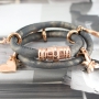 Nice stitched leather with beautiful findings and charms made of Designer Quality metal!