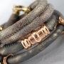 Nice stitched leather with beautiful findings and charms made of Designer Quality metal!