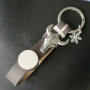 Jewellery and keychains with DQ leather cabochons.